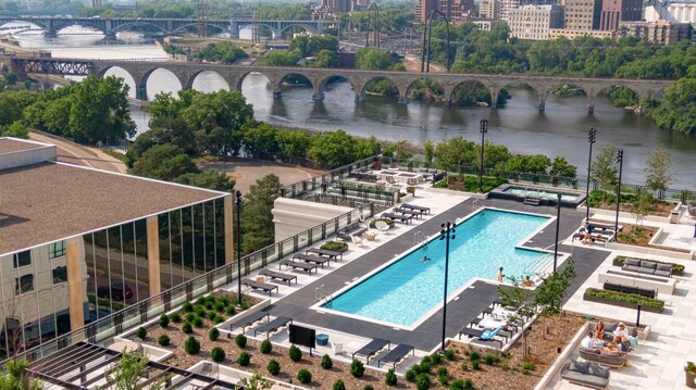 view of pool with a water view