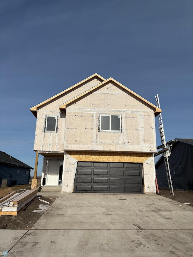 unfinished property with a garage