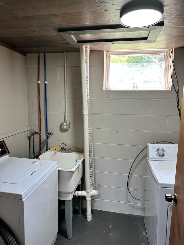 clothes washing area featuring washing machine and clothes dryer