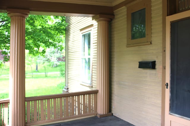 wooden terrace with covered porch