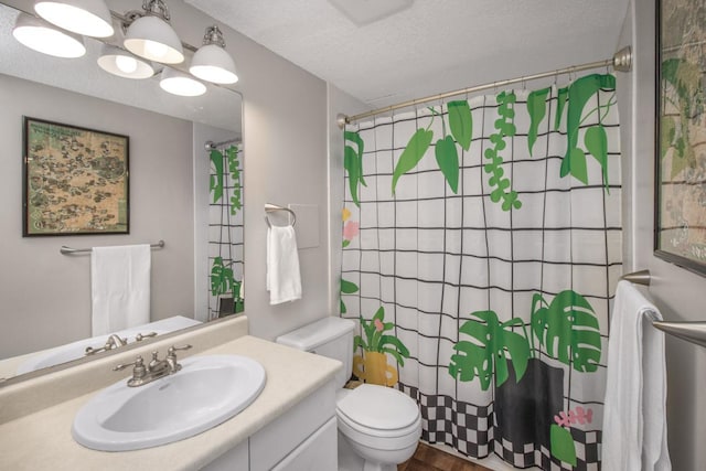 bathroom featuring toilet, hardwood / wood-style flooring, a textured ceiling, a shower with curtain, and vanity