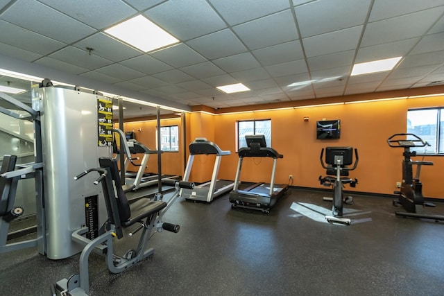 exercise room featuring a drop ceiling