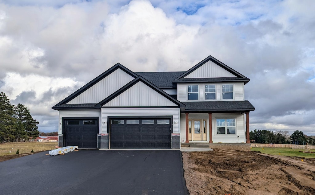 craftsman house with a garage