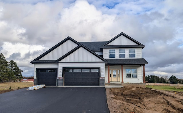 craftsman house with a garage