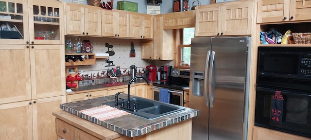 kitchen with sink, tile countertops, light brown cabinetry, and black appliances