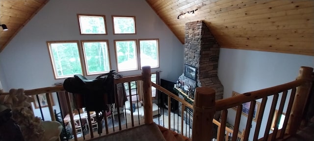 staircase with high vaulted ceiling and wooden ceiling