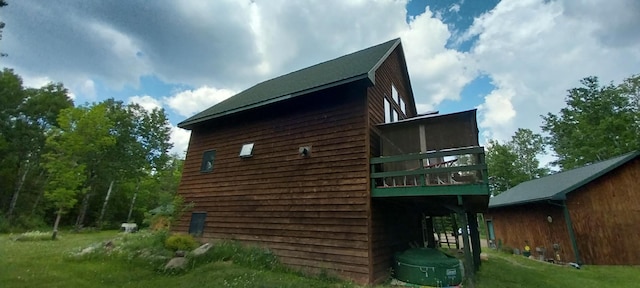 view of home's exterior with a yard