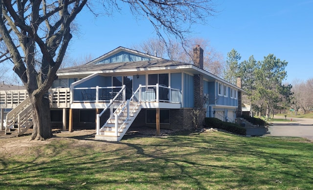 rear view of property with a yard