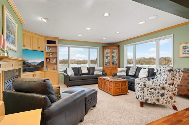 living area featuring a high end fireplace, light colored carpet, crown molding, and recessed lighting