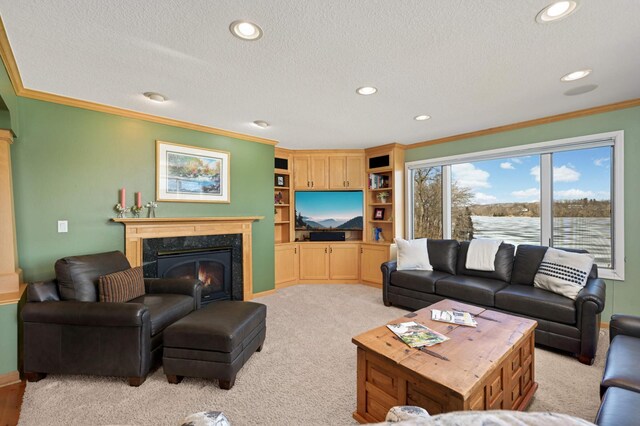 living area with a textured ceiling, recessed lighting, light colored carpet, a premium fireplace, and crown molding