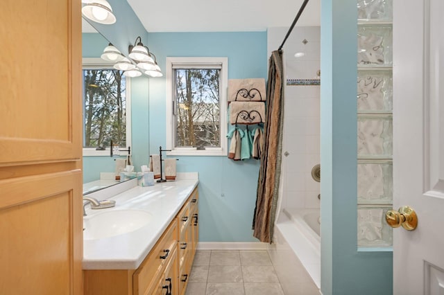 full bathroom featuring shower / tub combo, tile patterned floors, baseboards, and vanity