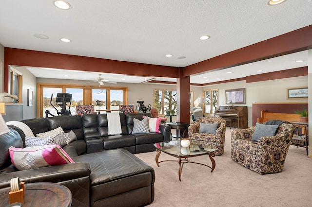 living room featuring a textured ceiling, carpet floors, and recessed lighting