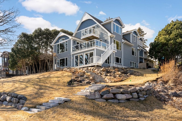 back of property with a balcony