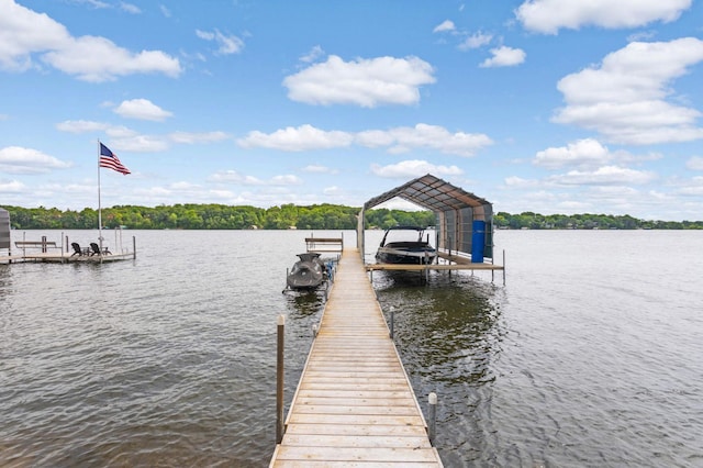 dock area with a water view and boat lift