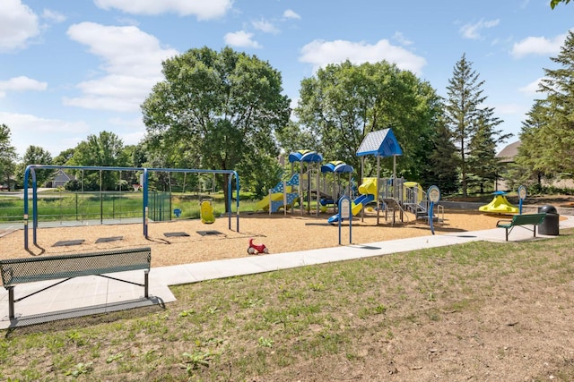 community play area featuring a lawn