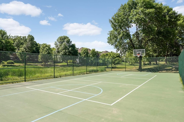 view of basketball court featuring community basketball court and fence