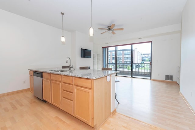 kitchen with sink, light hardwood / wood-style flooring, ceiling fan, stainless steel dishwasher, and light brown cabinets