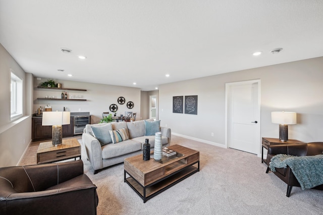 living room with light carpet and indoor bar