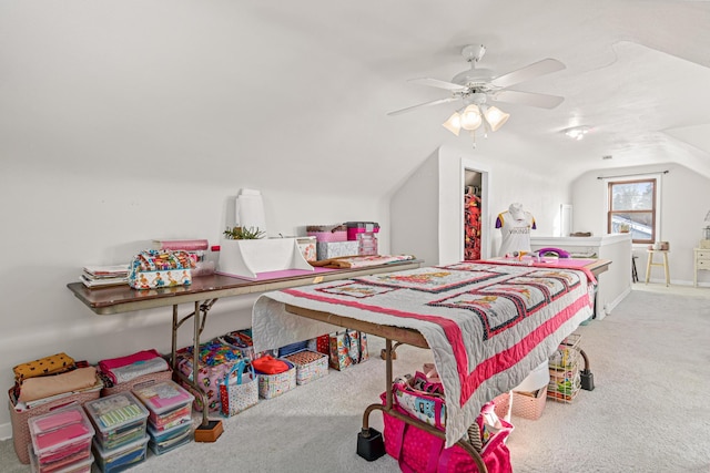 bedroom featuring vaulted ceiling, ceiling fan, and carpet floors