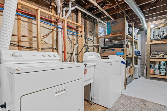 laundry room with laundry area and washing machine and clothes dryer