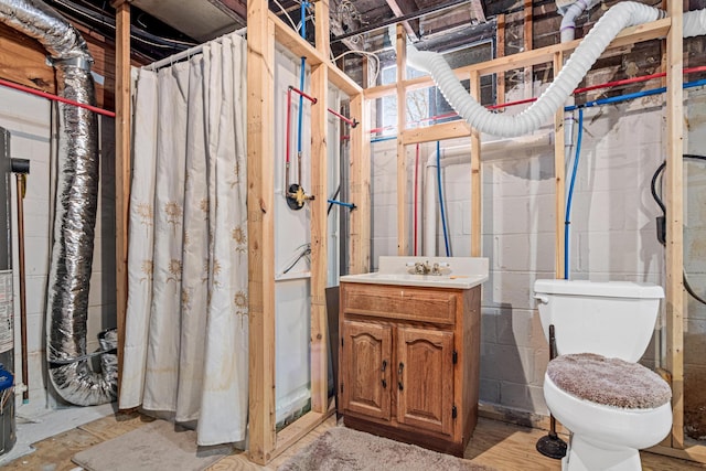 bathroom featuring toilet and vanity