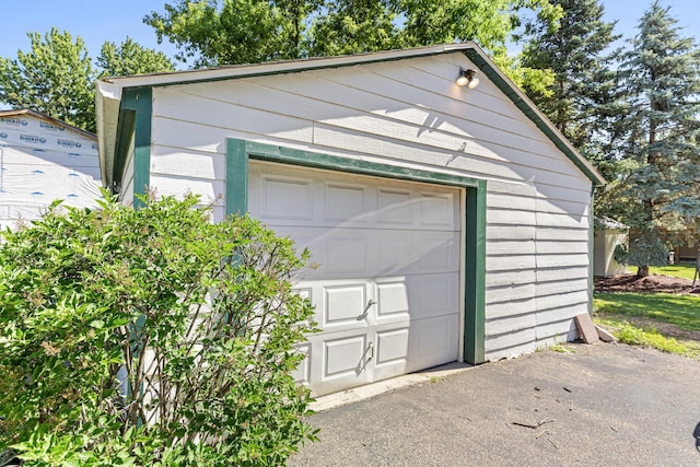 detached garage with aphalt driveway