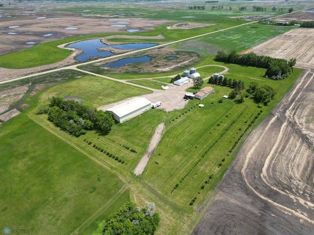 drone / aerial view featuring a water view and a rural view