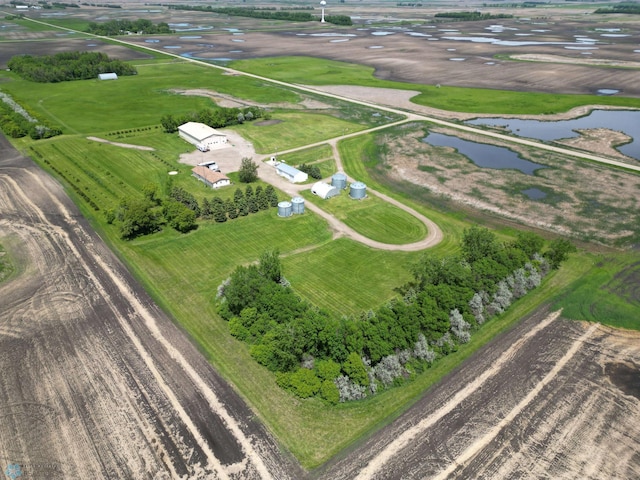 drone / aerial view featuring a water view and a rural view