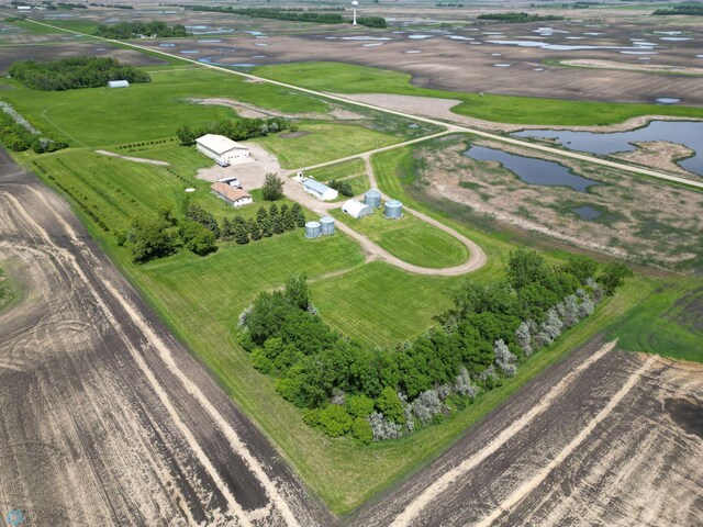 drone / aerial view featuring a water view and a rural view