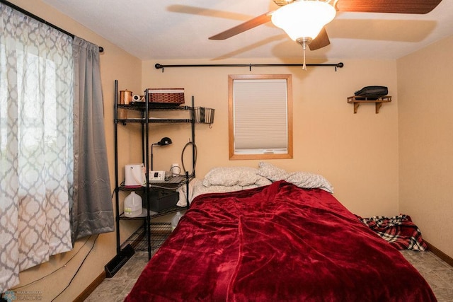 bedroom featuring tile flooring and ceiling fan