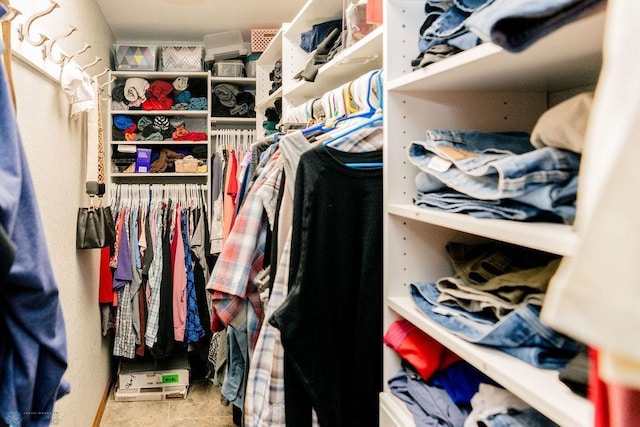 walk in closet featuring tile flooring