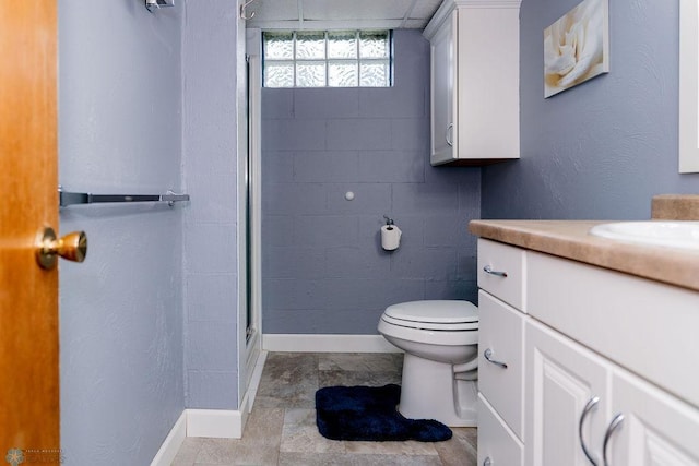 bathroom with vanity, toilet, and tile floors