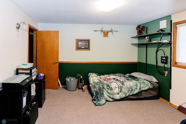 carpeted bedroom with baseboards