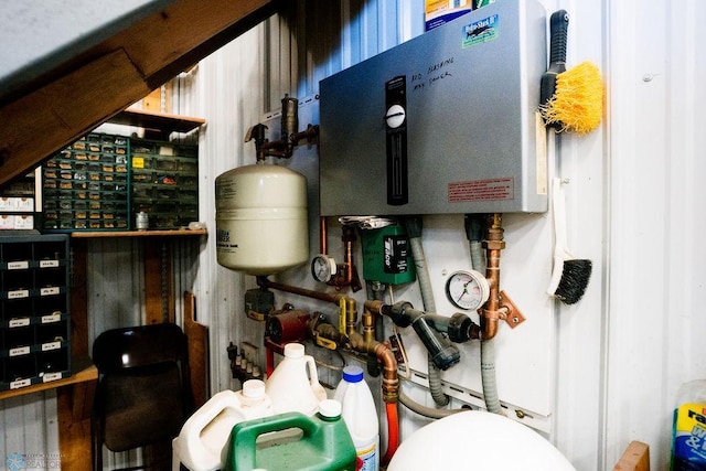 utility room featuring water heater