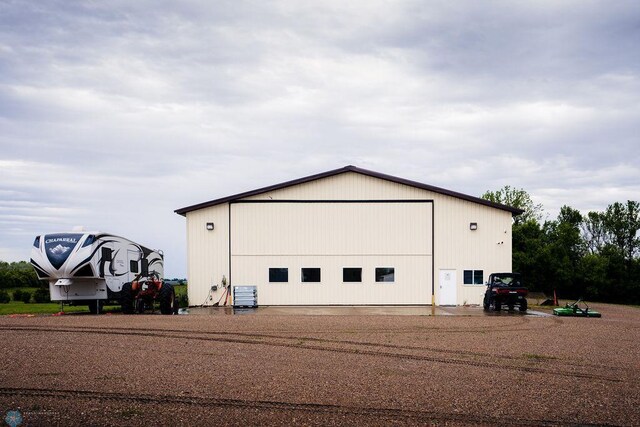 detached garage featuring central air condition unit