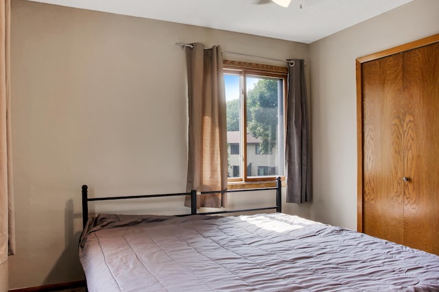 unfurnished bedroom with a closet and ceiling fan