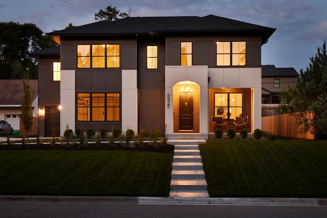 view of front of home with a lawn