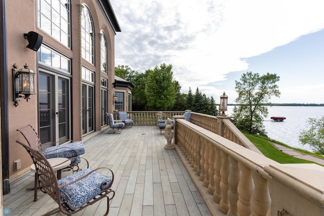 deck featuring a water view