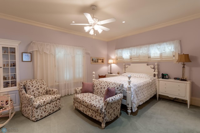 bedroom featuring carpet, ceiling fan, and crown molding