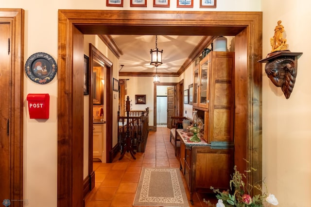 hallway featuring tile flooring and crown molding