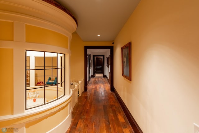 corridor featuring dark wood-type flooring