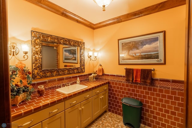 45329 Red Pine Loop, Perham Twp, MN 56573 - bathroom featuring vanity, tile walls, a wainscoted wall, and ornamental molding
