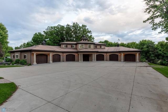 45329 Red Pine Loop, Perham Twp, MN 56573 - view of front of home featuring concrete driveway, stucco siding, and a garage