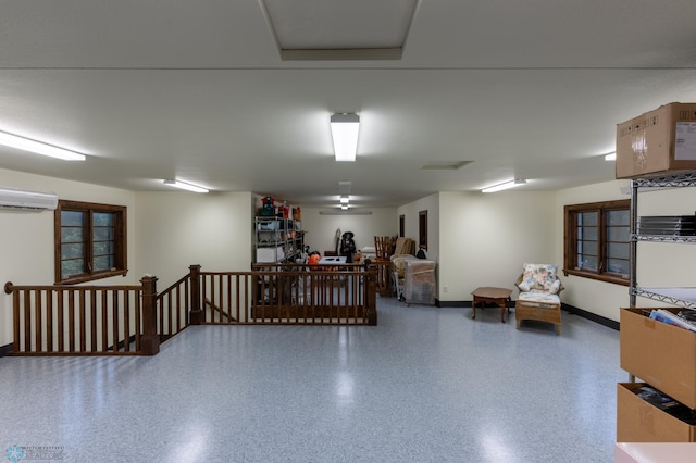 45329 Red Pine Loop, Perham Twp, MN 56573 - garage with baseboards and an AC wall unit