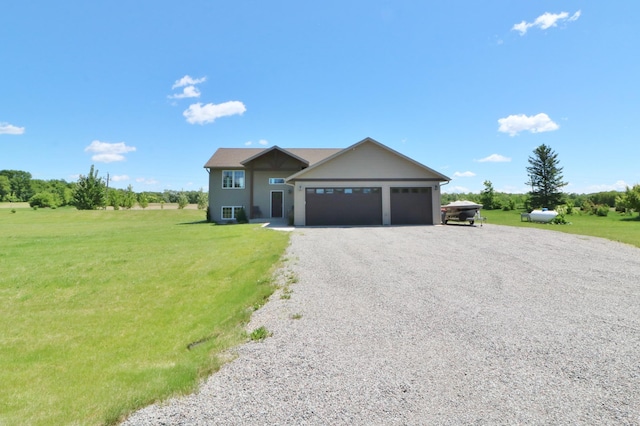 view of front of house featuring a garage and a front yard