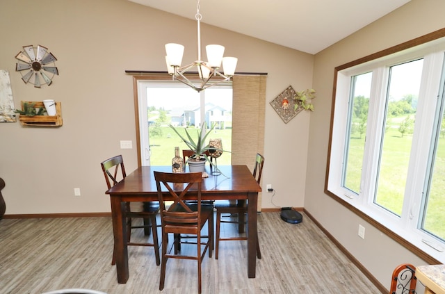 dining area with a wealth of natural light and lofted ceiling