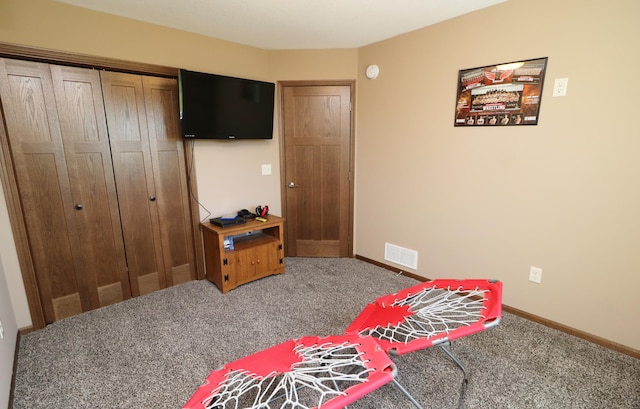 carpeted bedroom with a closet