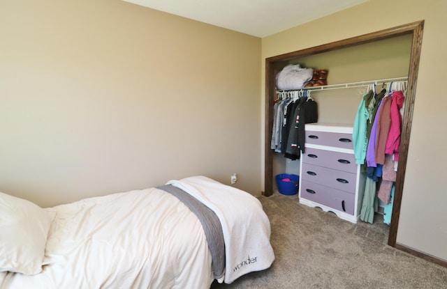 bedroom with carpet floors and a closet