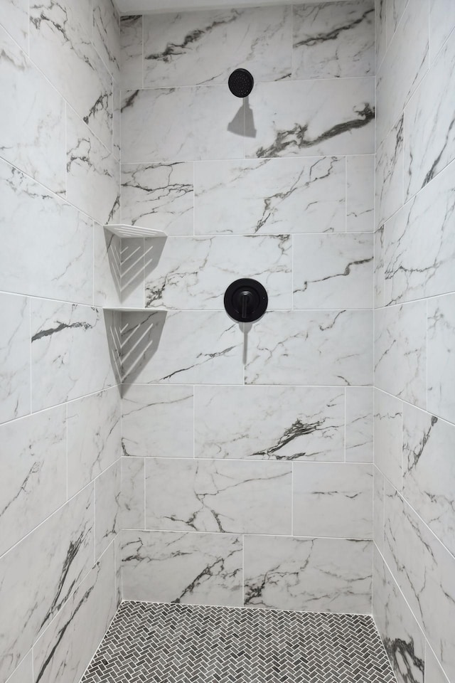 bathroom with a tile shower