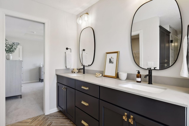 bathroom featuring vanity and parquet floors